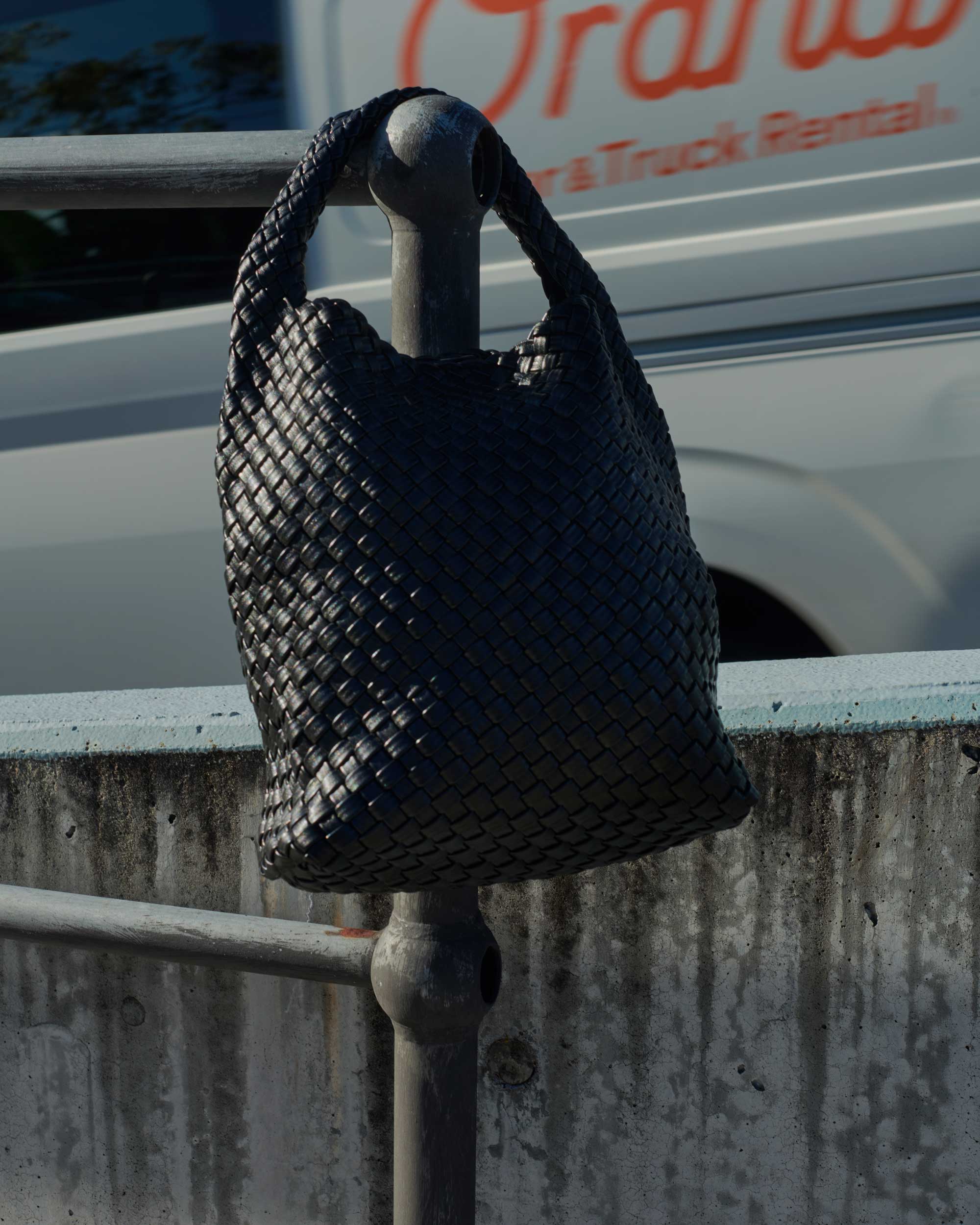 Black woven leather bag sale